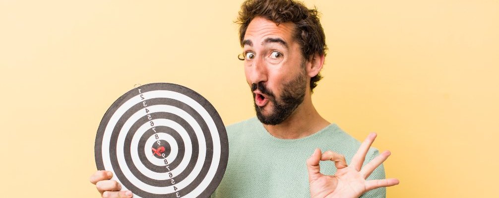 man with a darts target